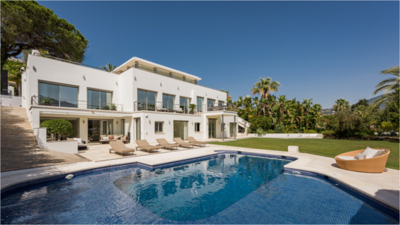 Contemporary facade of the luxury villa in Las Brisas, Nueva Andalucia, featuring a private pool and sun terrace.